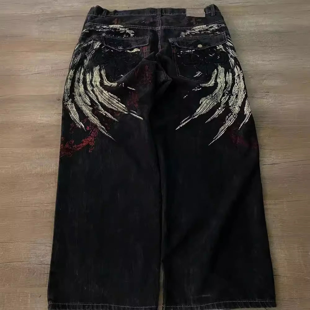 Men's hip hop embroidered loose jeans black — back view showing gold wing embroidery and red graphic print | FreyaVibe