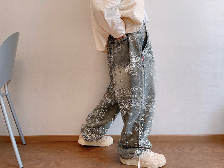 FreyaVibe paisley print washed jeans — side profile view showing loose straight-leg silhouette and all-over print detail