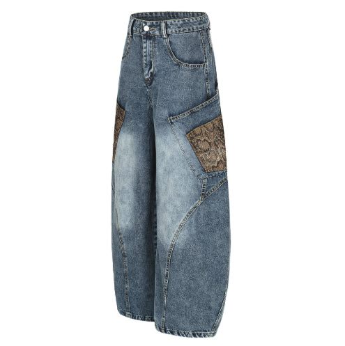 FreyaVibe men's washed wide-leg denim jeans — angled side view showing barrel leg silhouette and snake print detail