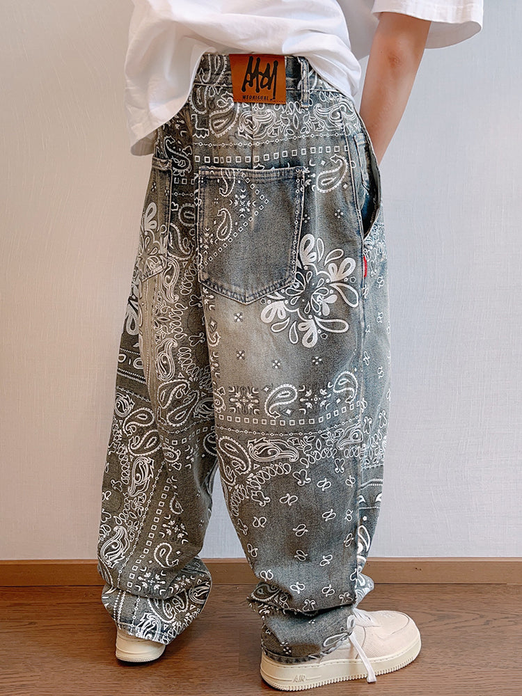 FreyaVibe paisley print washed jeans back view — full length showing back pockets and all-over white bandana print on blue denim