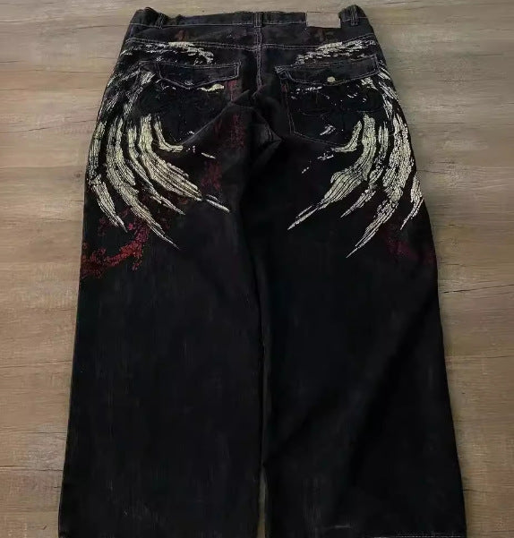 FreyaVibe men's black graphic embroidered jeans back full length — gold wing print and red artistic detailing