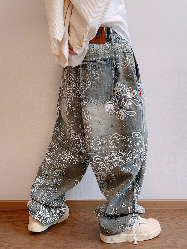 FreyaVibe paisley print loose jeans side view — back pocket and leather label detail on washed blue all-over bandana print denim
