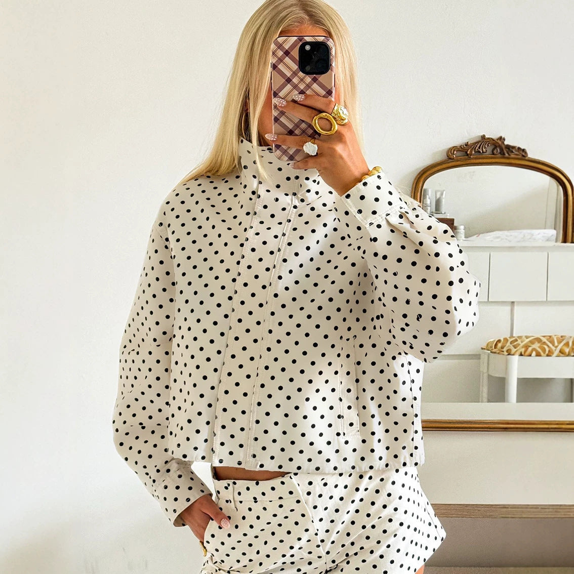 Polka dot cropped jacket in white – mirror selfie showing drawstring waist and relaxed oversized fit
