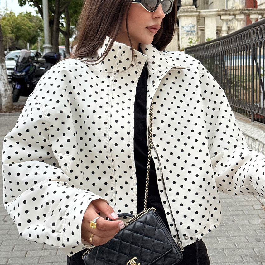 Polka dot cropped jacket in white and black – close-up front view showing collar and polka dot print detail

