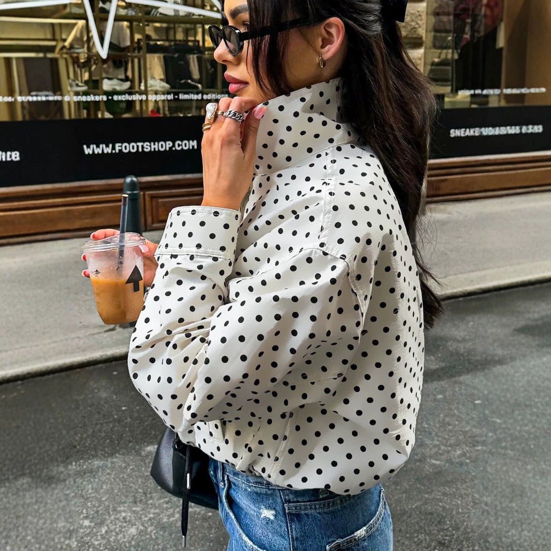 Polka dot cropped jacket in white – on model back and side view showing cropped length and long sleeves
