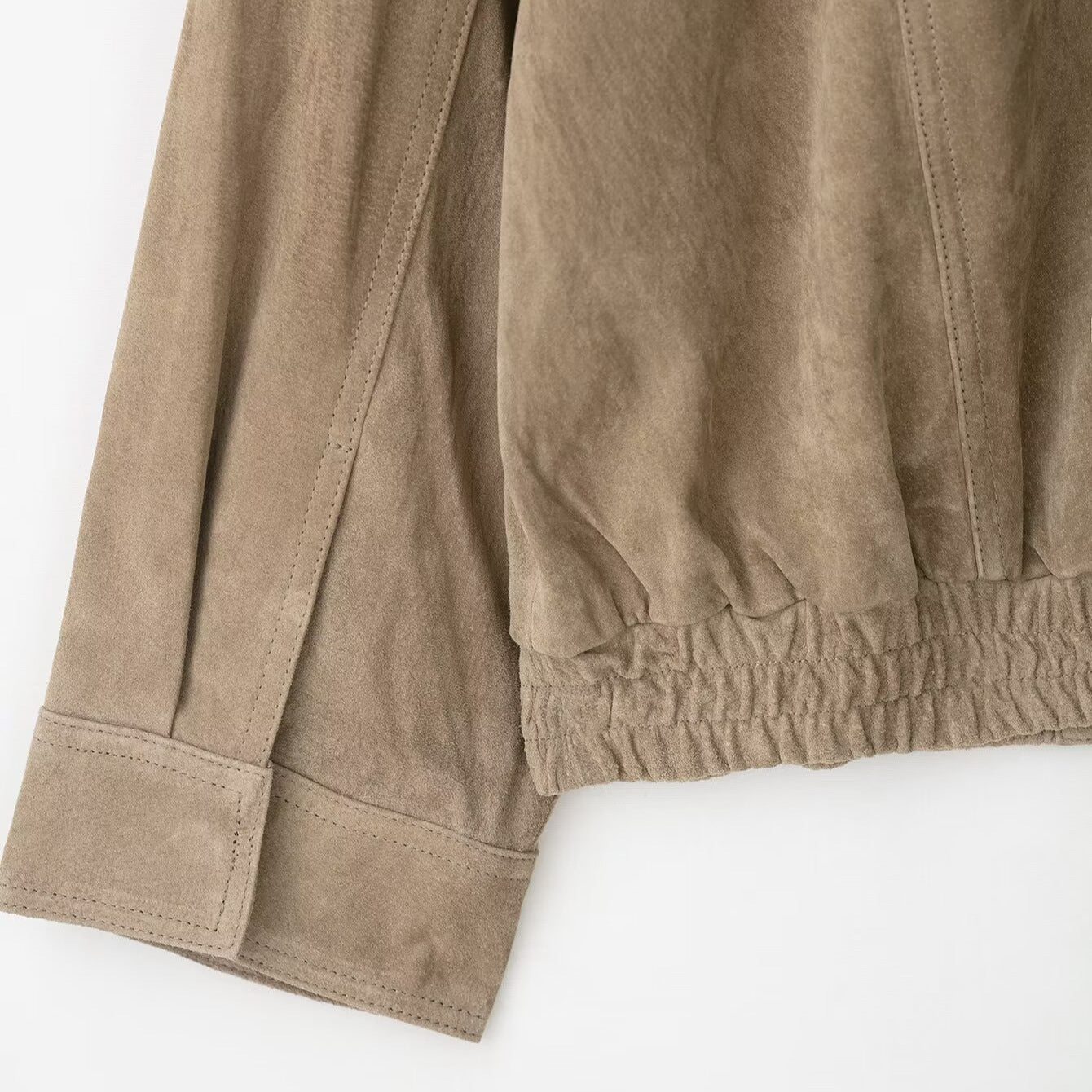 Suede texture leather coat fabric close-up – black colourway