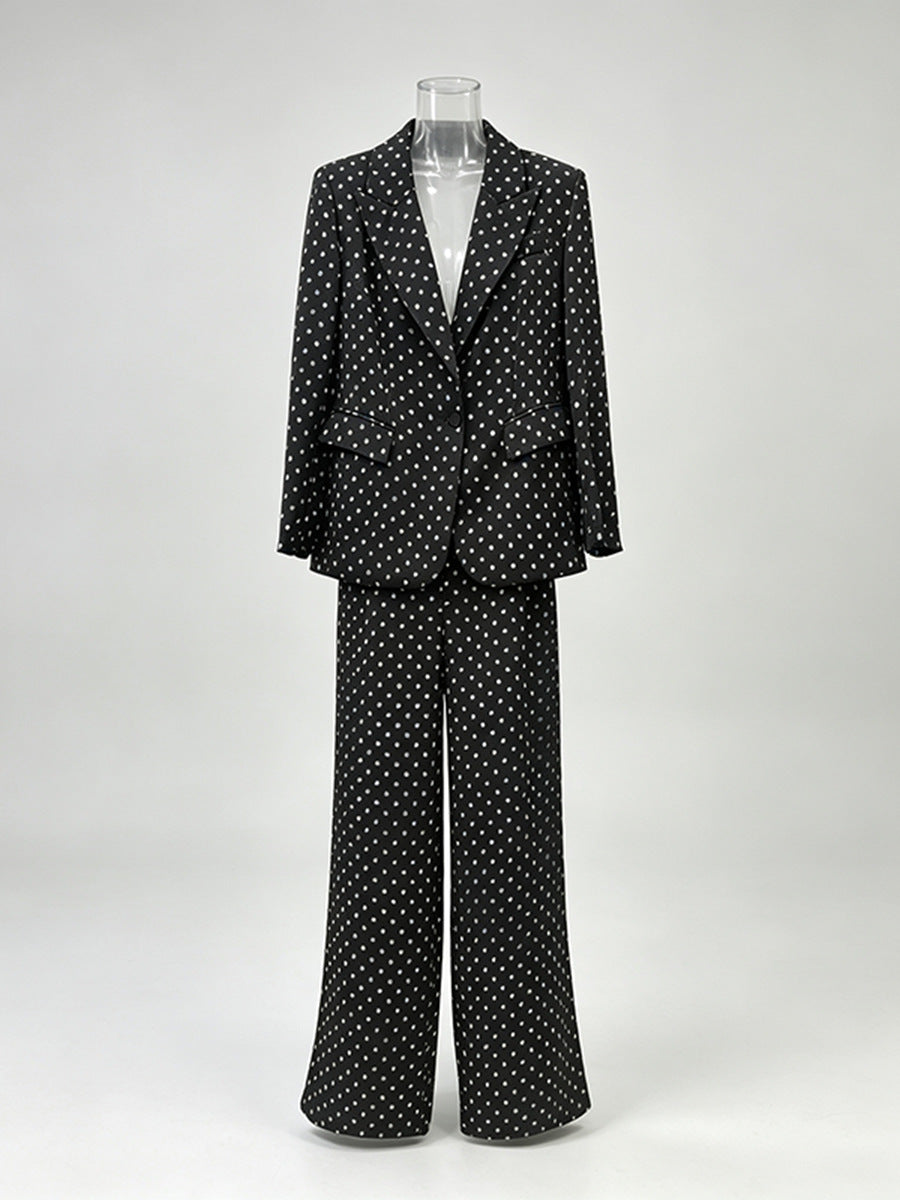 Polka dot blazer and wide leg trouser suit set in black – flat-lay front view showing notched lapel blazer and floor length trousers

