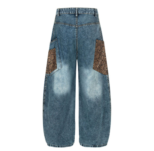 FreyaVibe retro wide-leg jeans back angled view — acid wash blue denim with python print patchwork pockets