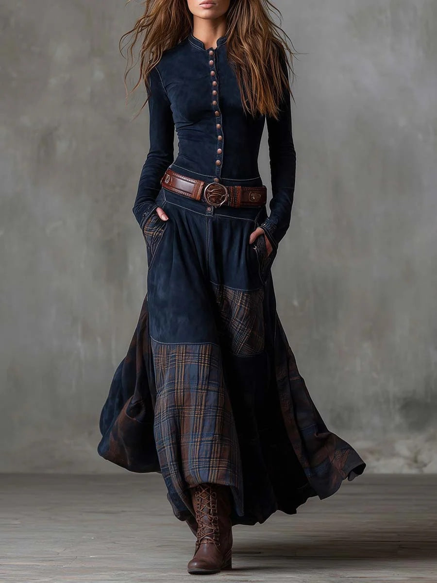 The Moorland Patchwork Maxi Dress FV in navy blue — button-front bodice with plaid panel wide-leg skirt, styled with leather belt and boots