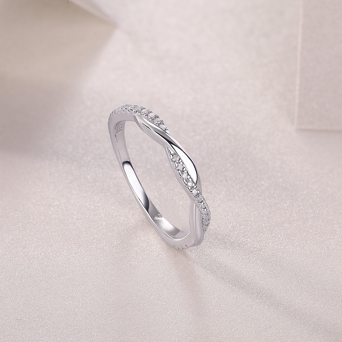 Close-up of moissanite stone on FreyaVibe platinum-plated S925 silver wedding ring